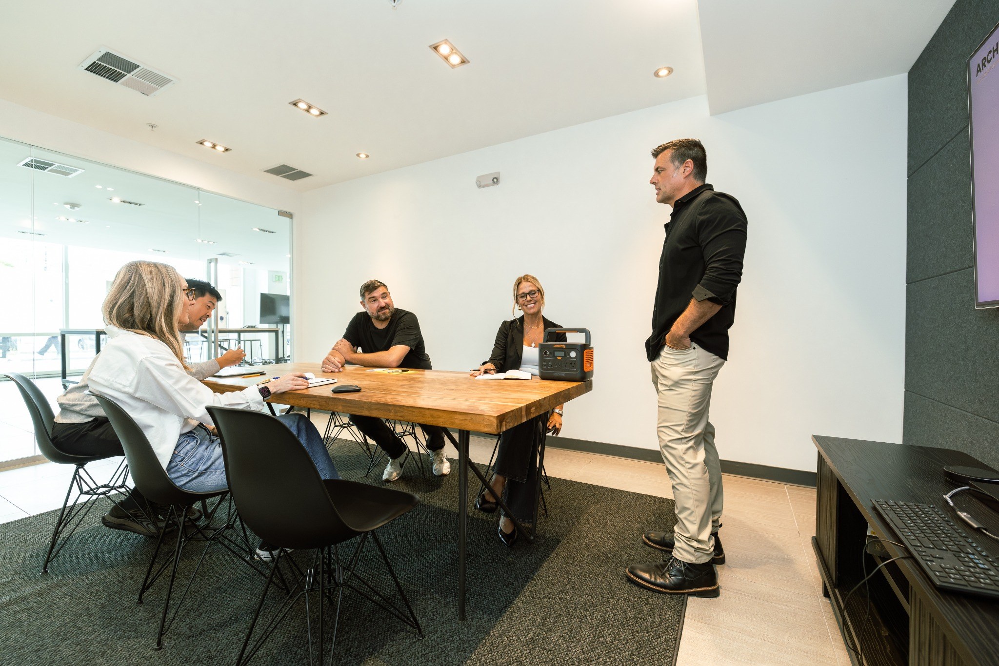 Huge Design team reviewing a product in the new studio meeting room